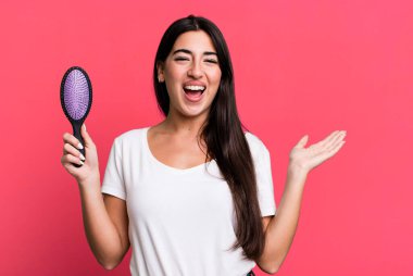 feeling happy, surprised realizing a solution or idea. hair comb concept