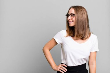 pretty blonde woman presenting a concept with a copy space