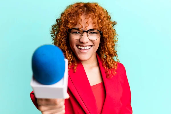 red hair pretty journalist or presenter woman with a micro