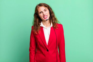 hispanic pretty woman feeling puzzled and confused. telemarketing concept