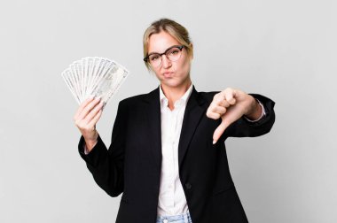 pretty caucasian businesswoman with dollar banknotes