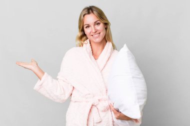 pretty caucasian woman wearing night wear and a pillow