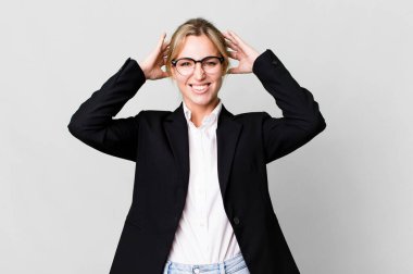 caucasian blonde woman feeling stressed, anxious or scared, with hands on head. business concept