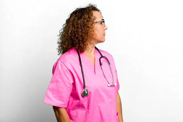 Pretty Middle Age Woman Profile View Thinking Imagining Daydreaming Nurse — Stockfoto
