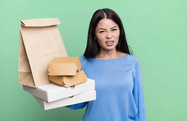 Hispanic Pretty Woman Feeling Puzzled Confused Take Away Fast Food — Foto Stock