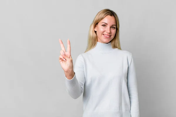 Caucasian Blonde Woman Smiling Looking Friendly Showing Number Two Copy —  Fotos de Stock