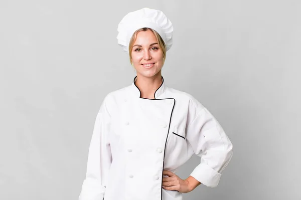 Caucasian Blonde Woman Smiling Happily Hand Hip Confident Chef Concept — Zdjęcie stockowe