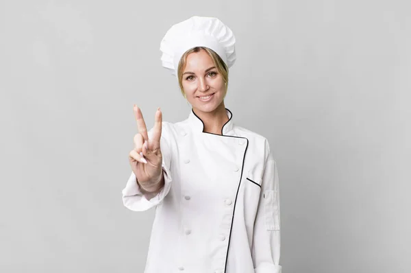 Caucasian Blonde Woman Smiling Looking Happy Gesturing Victory Peace Chef — Zdjęcie stockowe
