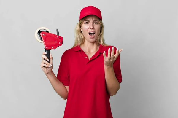 Caucasian Blonde Woman Looking Desperate Frustrated Stressed Shipping Packer Concept — Stockfoto