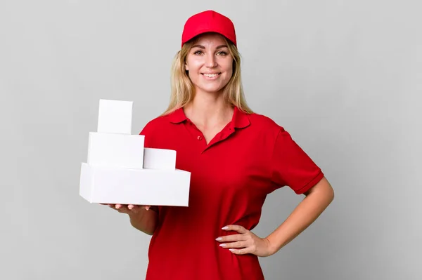 Caucasian Blonde Woman Smiling Happily Hand Hip Confident Delivery Boxes — Stockfoto