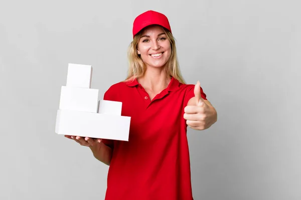 Caucasian Blonde Woman Feeling Proud Smiling Positively Thumbs Delivery Boxes — Stockfoto