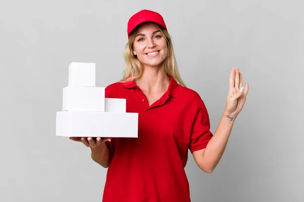 Caucasian Blonde Woman Smiling Looking Friendly Showing Number Four Delivery — Stockfoto