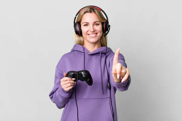 Caucasian Blonde Woman Smiling Proudly Confidently Making Number One Gamer — Foto Stock