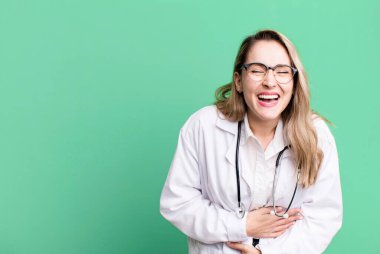 laughing out loud at some hilarious joke. medicine student or physician