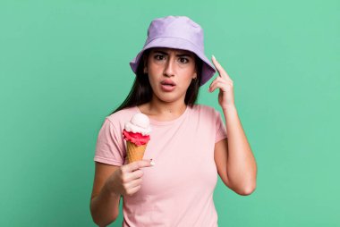 looking surprised, realizing a new thought, idea or concept. ice cream and summer concept