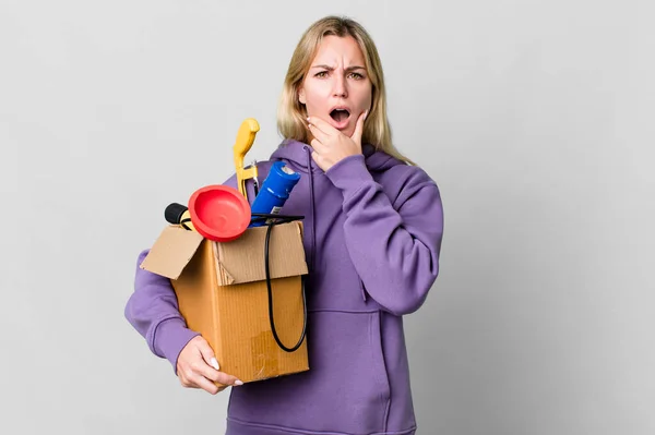Caucasian Blonde Woman Mouth Eyes Wide Open Hand Chin Housekeeper — Stockfoto