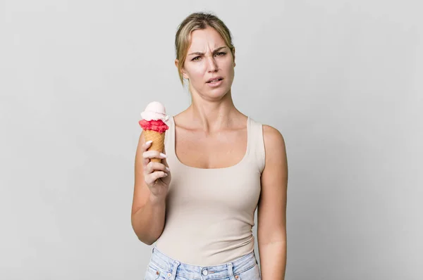 Caucasian Blonde Woman Feeling Puzzled Confused Ice Cream Concept — Stockfoto