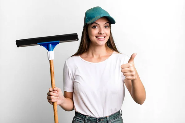 Young Pretty Woman Feeling Proud Smiling Positively Thumbs Cleaning Windows —  Fotos de Stock