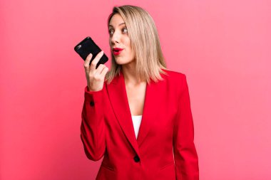 young pretty businesswoman using her smart phone