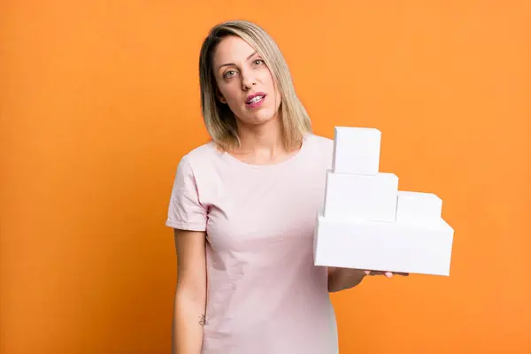 Pretty Blonde Woman Feeling Puzzled Confused Set Blank Packagings — Zdjęcie stockowe
