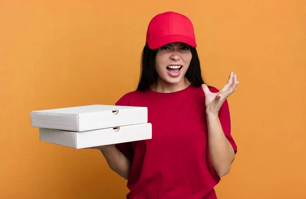 Hispanic Pretty Woman Looking Desperate Frustrated Stressed Delivery Pizza Concept — Stock fotografie