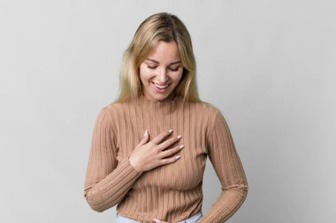 caucasian blonde woman laughing out loud at some hilarious joke