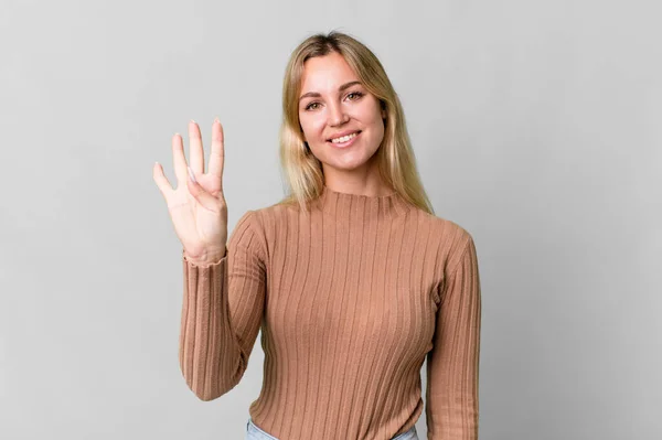 Caucasian Blonde Woman Smiling Looking Friendly Showing Number Four — Stockfoto