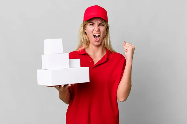 Caucasian Blonde Woman Shouting Aggressively Angry Expression Delivery Boxes — Stockfoto