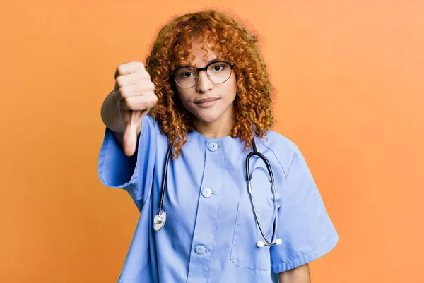 Red Hair Pretty Woman Feeling Cross Showing Thumbs Nurse Concept — Stock Photo, Image