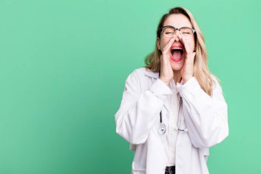 feeling happy,giving a big shout out with hands next to mouth. medicine student or physician