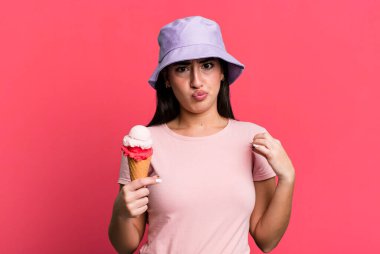 looking arrogant, successful, positive and proud. ice cream and summer concept