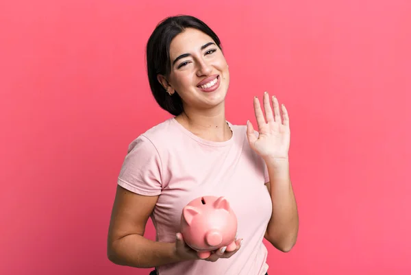 Smiling Happily Waving Hand Welcoming Greeting You Piggy Bank — Stockfoto