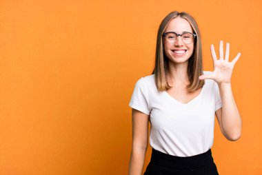 pretty blonde woman presenting a concept with a copy space