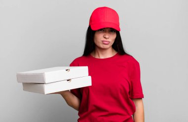 hispanic pretty woman feeling sad and whiney with an unhappy look and crying. delivery pizza concept