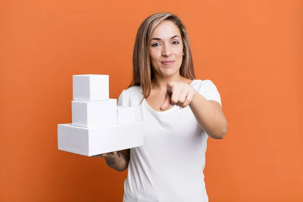 Pretty Blonde Woman Pointing Camera Choosing You Set Different Packagings — Stockfoto