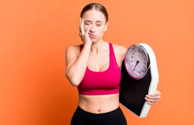 caucasian pretty woman feeling bored, frustrated and sleepy after a tiresome. fitness and diet concept