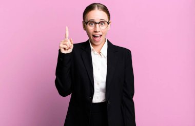 caucasian pretty woman feeling like a happy and excited genius after realizing an idea. business concept