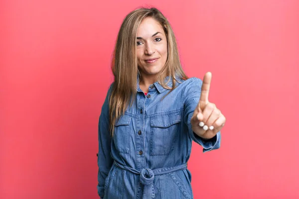 Blonde Adult Woman Smiling Proudly Confidently Making Number One Pose — Stockfoto