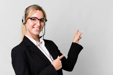 pretty caucasian blonde businesswoman real state agent with headset