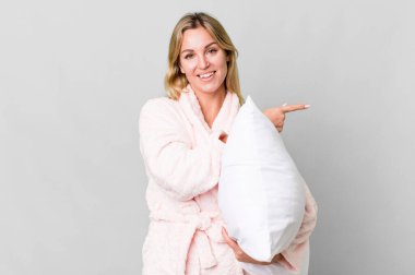 pretty caucasian woman wearing night wear and a pillow