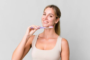 pretty caucasian woman with a toothbrush