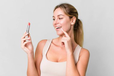 pretty caucasian woman using a red lipstick