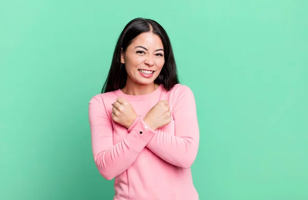 Pretty Latin Woman Smiling Cheerfully Celebrating Fists Clenched Arms Crossed — Stockfoto