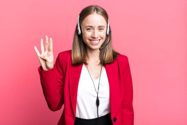 smiling and looking friendly, showing number four. telemarketer concept