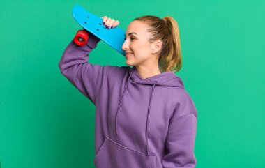 young pretty woman with a skate board