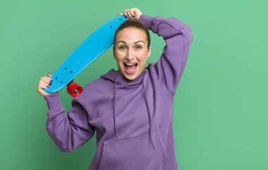 young pretty woman with a skate board