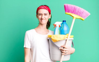 young pretty woman looking puzzled and confused. housekeeper concept