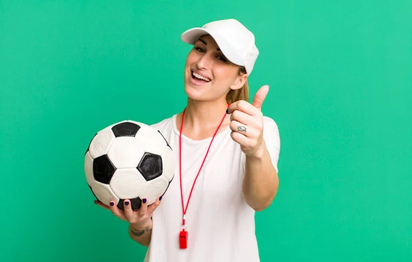 Young Pretty Woman Feeling Proud Smiling Positively Thumbs Soccer Coach — Stock fotografie