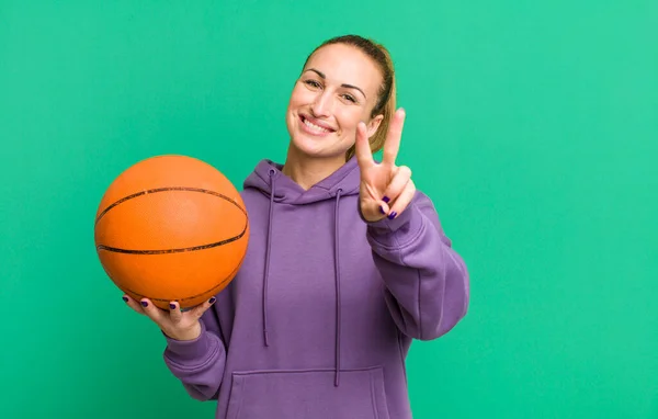 Young Pretty Woman Smiling Looking Happy Gesturing Victory Peace Basketball — Stock fotografie