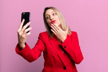 young pretty businesswoman using her smart phone